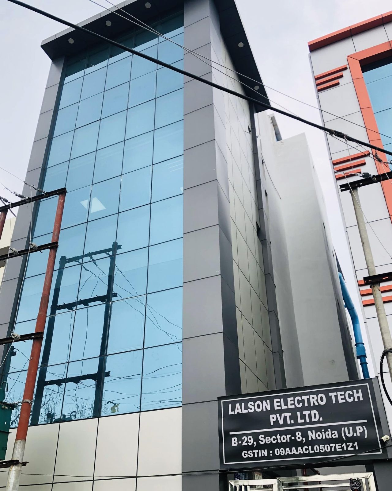 The Lalson Electro Tech building at B-29, Sector 8, Noida, with the company signboard at the entrance